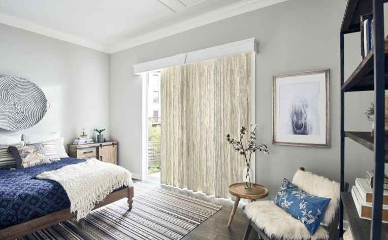natural drapes in bedroom with blue accents