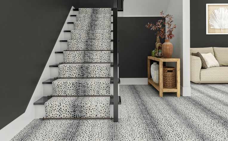 modern patterned carpet on entryway staircase with dark grey walls