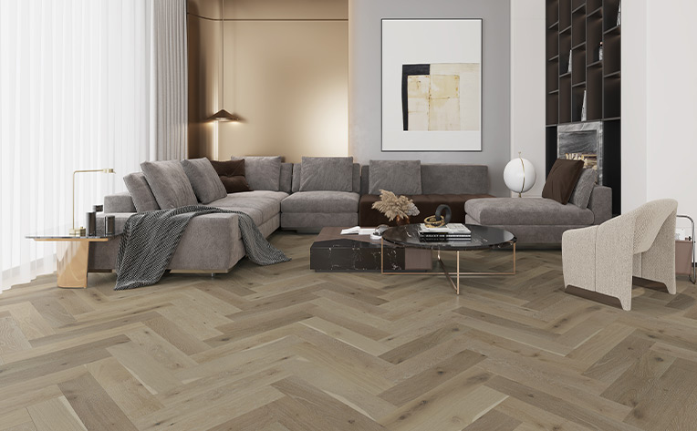 herringbone hardwood flooring in living room with couch