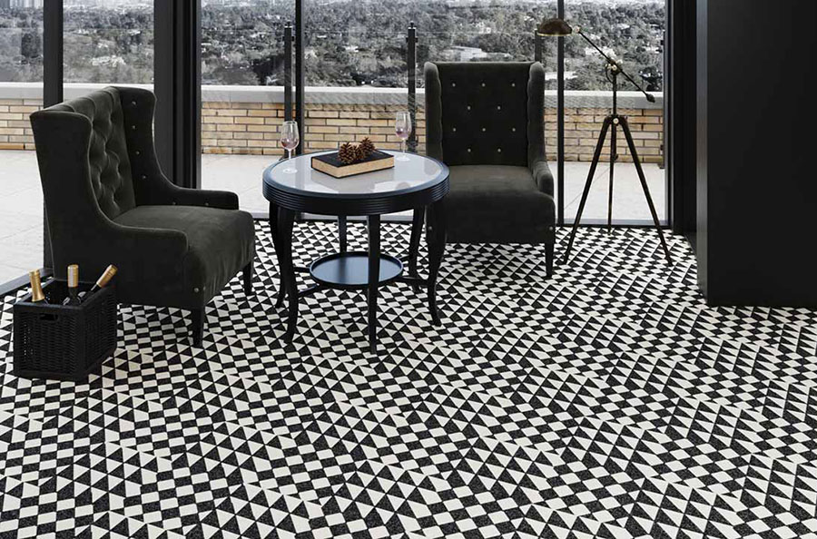 Sitting room with plush black high back chairs, white and black table, on black and white checkered tile.