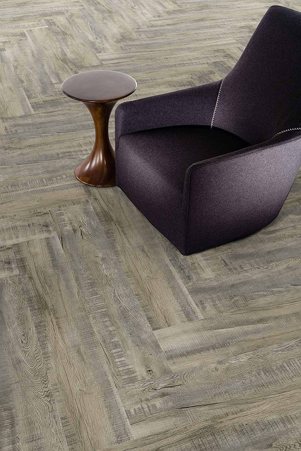Close up picture highlighting the trending 2020 themed herringbone flooring installation pattern.