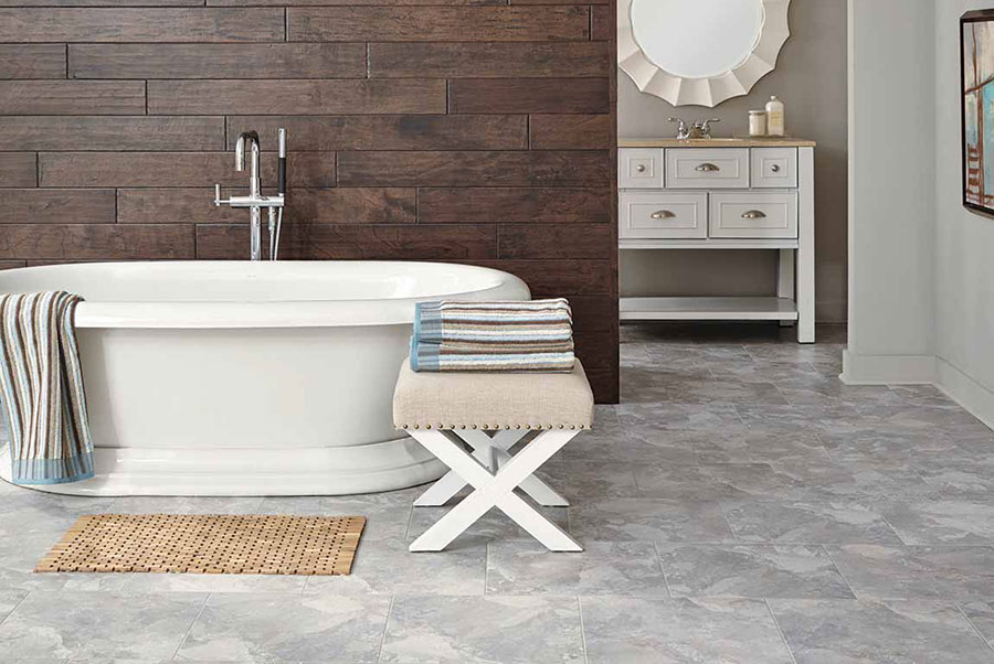 Luxury grey tile in bathroom with soaking tub