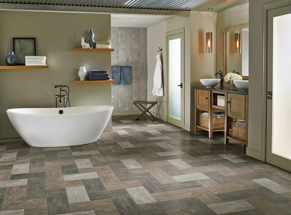 bathroom with pattern tiled flooring and standalone tub