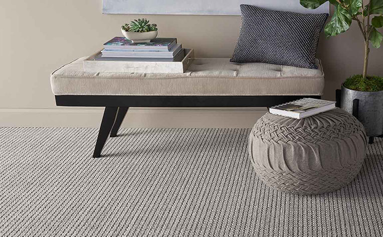 grey patterned carpet in grey tonal living room