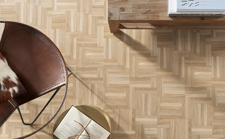 Close up picture of a 2020 themed flooring design that utilizes a natural look and herringbone style design.