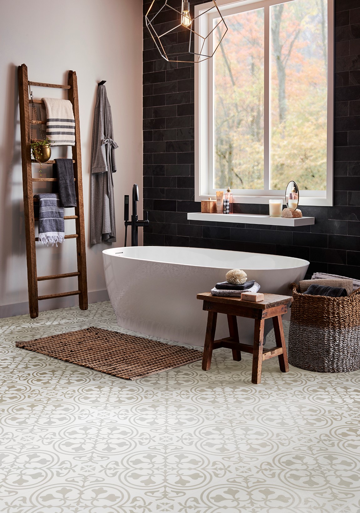 large bathroom with free standing tub and patterned lvt floor
